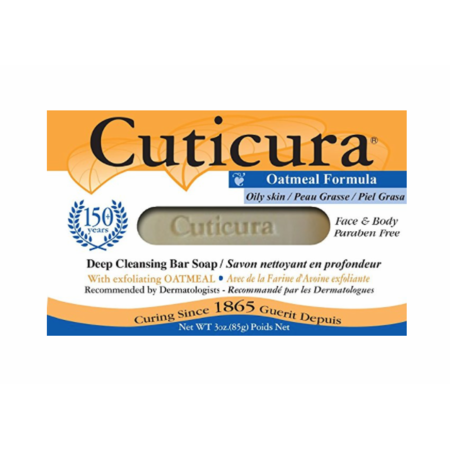 Cuticura Oily Skin Deep Cleansing Soap in 3 oz packaging, designed for oily skin, displayed with soap and lotion dispensers.