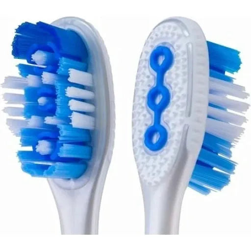 Elmex Medium Blue Toothbrush from Pasteur Pharmacy, showing a close-up of the toothbrush with blue and white bristles.