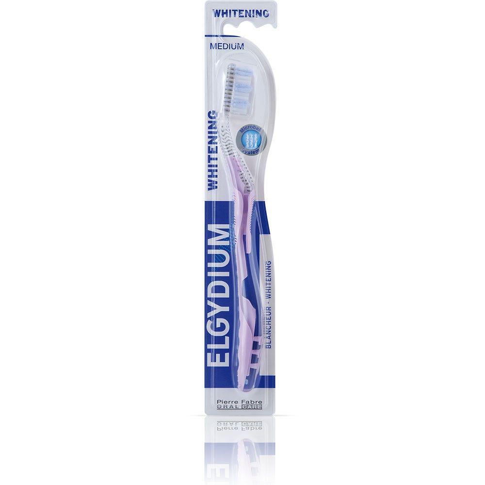 Elgydium Whitening Medium Toothbrush with ergonomic handle and soft bristles for effective teeth cleaning and whitening.