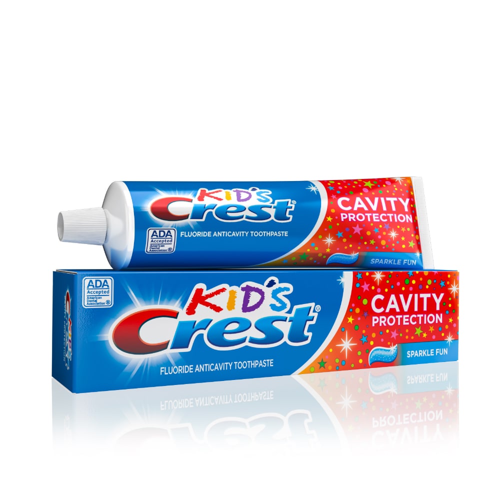 Crest Kids fluoride anticavity toothpaste in Sparkle Fun flavor, 4.6 oz tube, featuring colorful packaging and cartoon design.