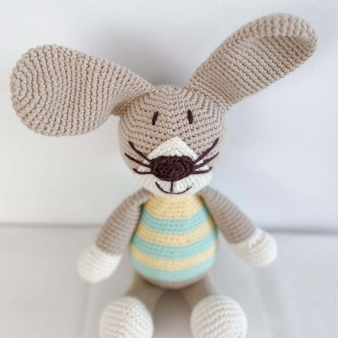 Green handmade stuffed rabbit named Pip by Bebemoss, crafted from organic cotton with soft, plush texture.