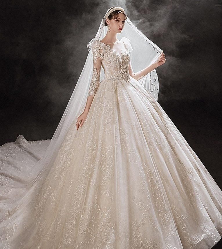 Elegant princess wedding dress by EdleessFashion with shiny pearls and flowing fabric, perfect for a fairytale bridal look.