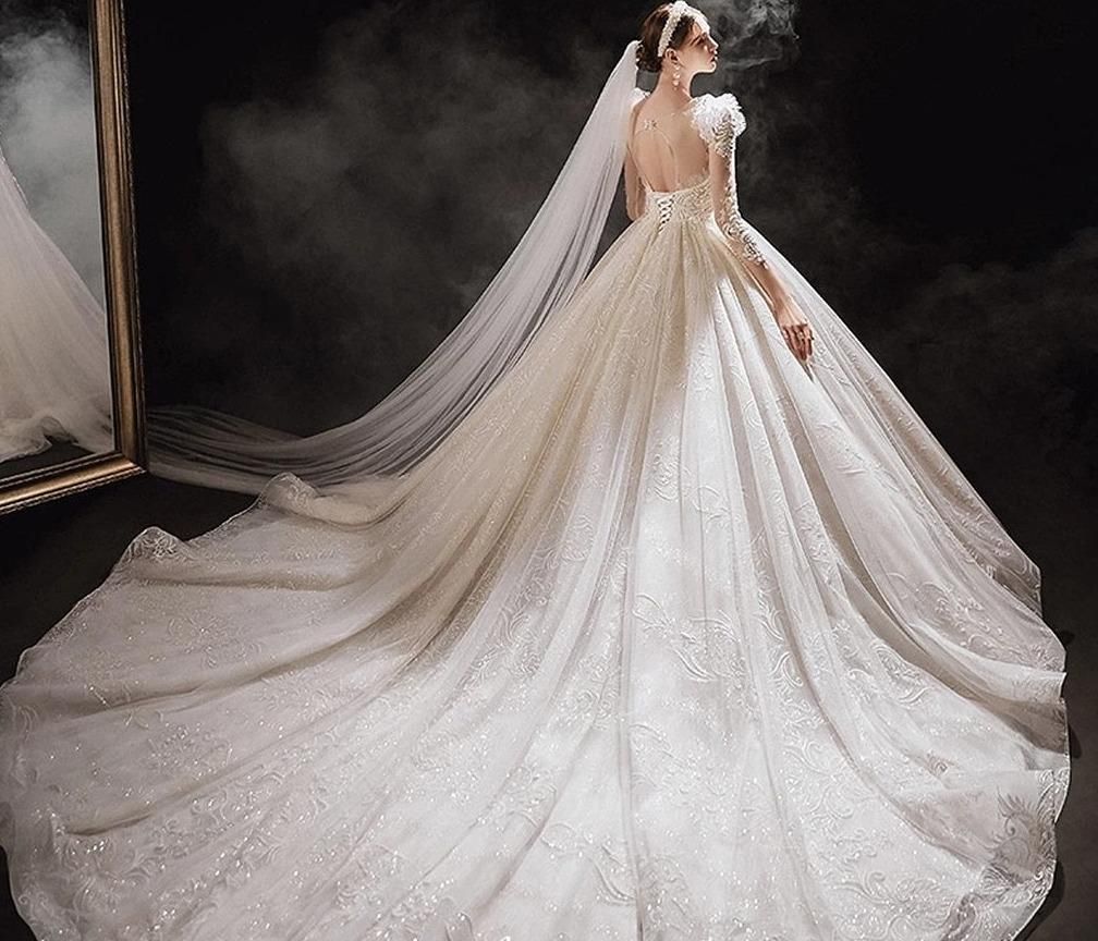 Elegant princess wedding dress with shiny pearls from EdleessFashion, featuring intricate details and a flowing gown silhouette.