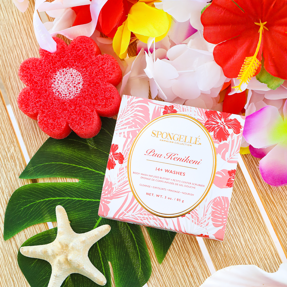 Hawaiian Pua Kenikeni body wash infused buffer by Spongellé with a textured sponge surface and tropical floral design.