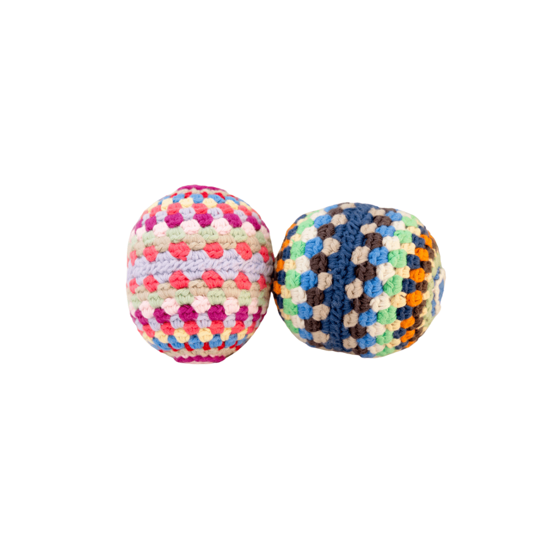 Colorful rainbow rattle ball toy made of handmade organic cotton, perfect for infants and sensory play.