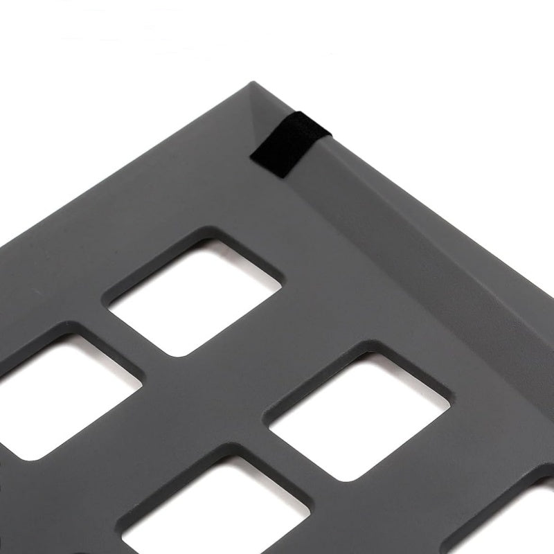 Pair of Tesla Cybertruck rear trunk lower grille baffles, black plastic covers, designed for truck airflow and protection.