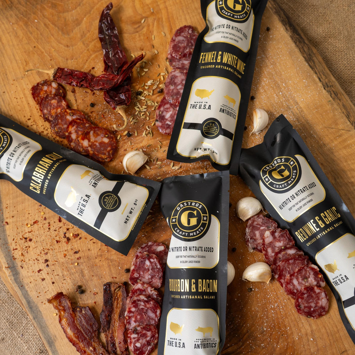 Four-piece Signature Set from Gastros Craft Meats featuring assorted cured meats and artisanal charcuterie slices.