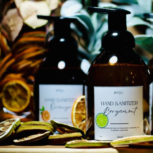 Restalgic Atelier organic foaming hand sanitizer in 16oz bottle with orange, peppermint, and bergamot scent, showing the label.