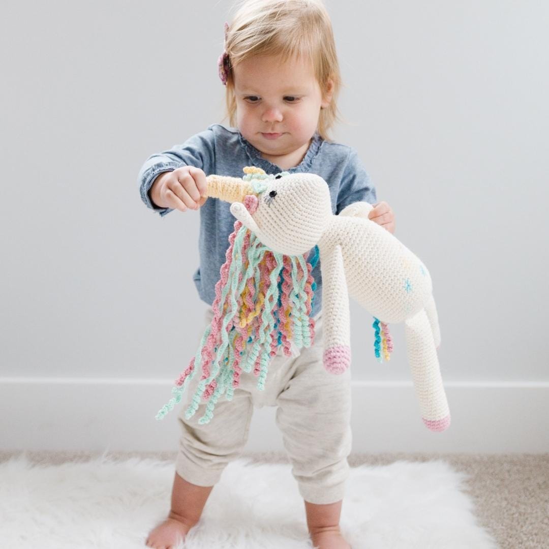 Handmade Rose the Unicorn stuffed animal made of organic cotton by Bebemoss, soft and adorable for children.