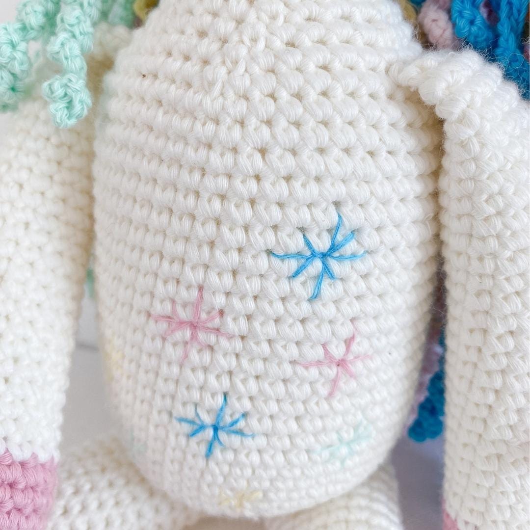Handmade organic cotton stuffed unicorn named Rose, plush toy with pastel pink and white features, by Bebemoss.com