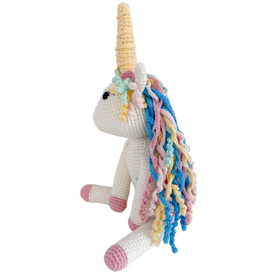 Handmade organic cotton stuffed unicorn named Rose by Bebemoss, soft and cute with pink accents and a gentle expression.