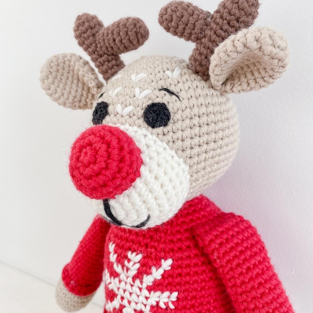 Handmade Ruddy the reindeer stuffed animal made from organic cotton, soft and cuddly, perfect for children.