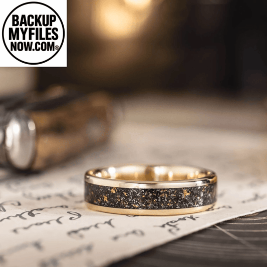 Men's gold wedding band with meteorite and gold flakes, featuring a 3mm wide yellow gold band from Rustic and Main.
