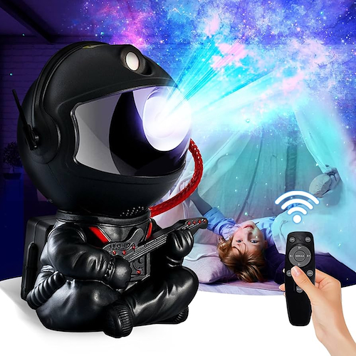 Black astronaut night light projector with starry night images, ideal for aesthetic room decor and gift-giving by Shaketea.