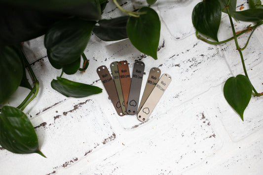 Faux leather "Made with Love" tag for handmade items, 2.5 x 0.5 inches, crafted for knitting and crochet projects.
