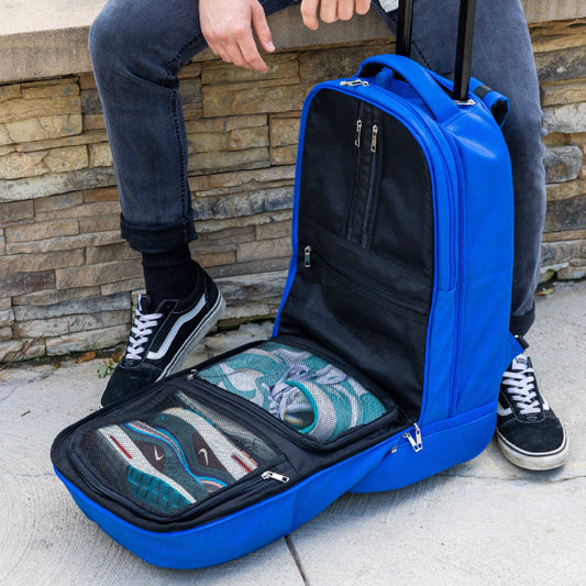 Royal blue leather carry-on roller bag by Sole Premise, signature style with limited edition design and durable wheels.