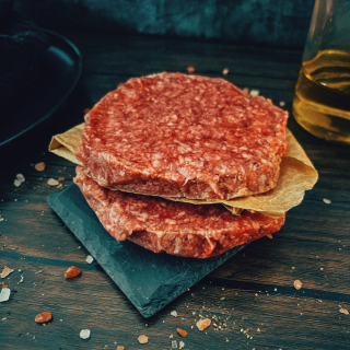 Square image of a burger featuring Wagyu beef from the FOF The Wagyu Welcome Box by Five Oaks Farm Wagyu.