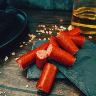 Five Oaks Farm Wagyu griller's box with snack sticks, showcasing premium beef snack sticks in a square package.