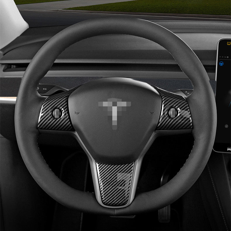 Tesla Model 3 and Y steering wheel cover patch by Tesery, showing a close-up of the textured black steering wheel cover.