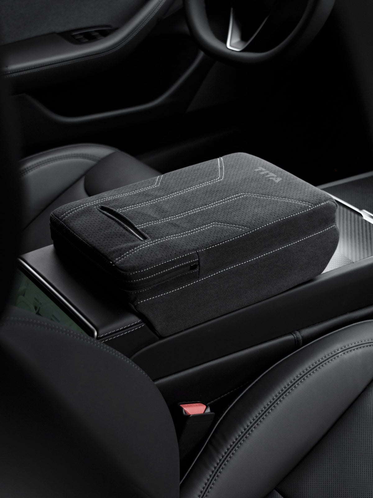 Suede armrest cover with raised pad and tissue box for Tesla Model Y Juniper and Model 3 Highland, providing comfort and protection.