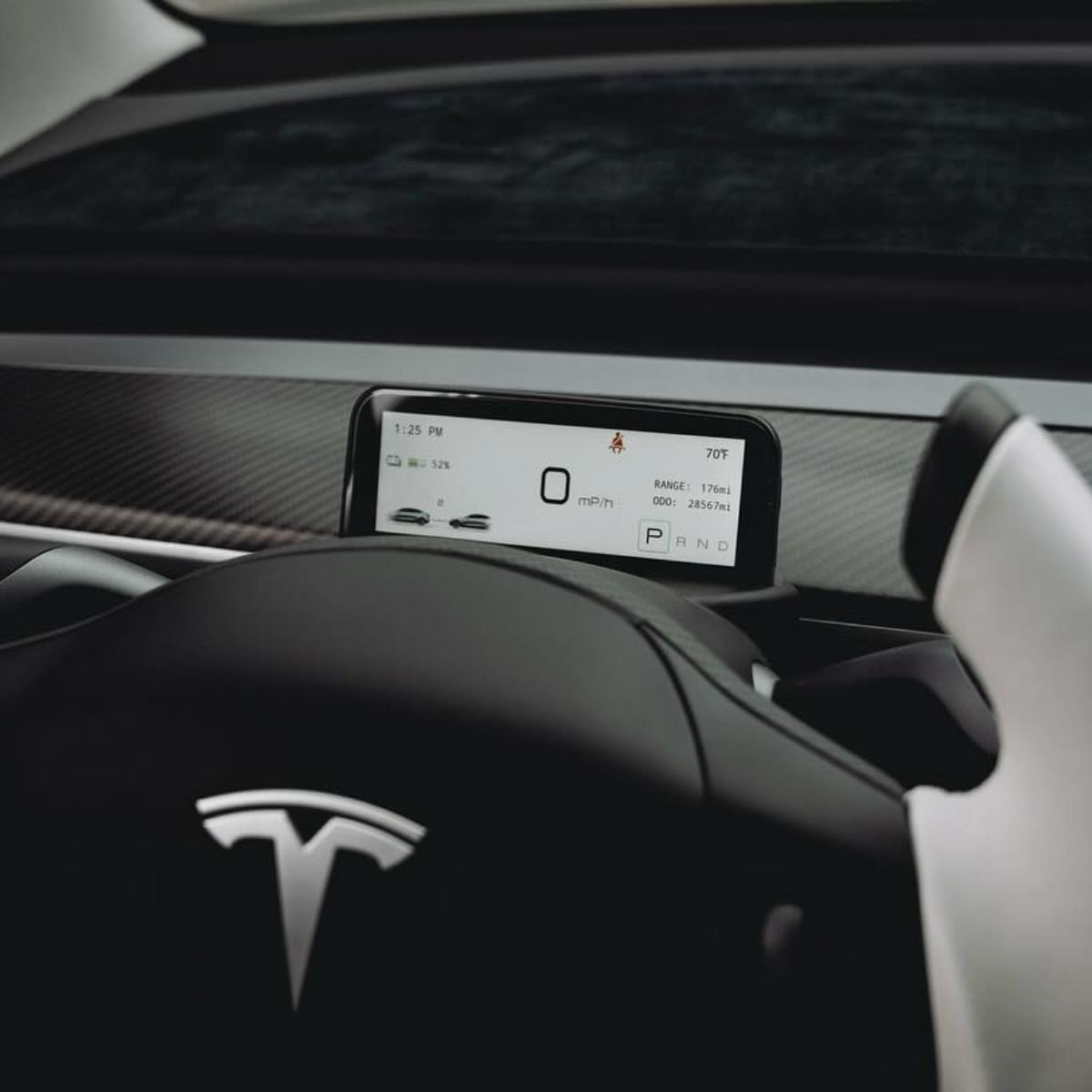 Tesla Model 3/Y mini dashboard display screen by TESERY showing a compact digital interface on a car dashboard