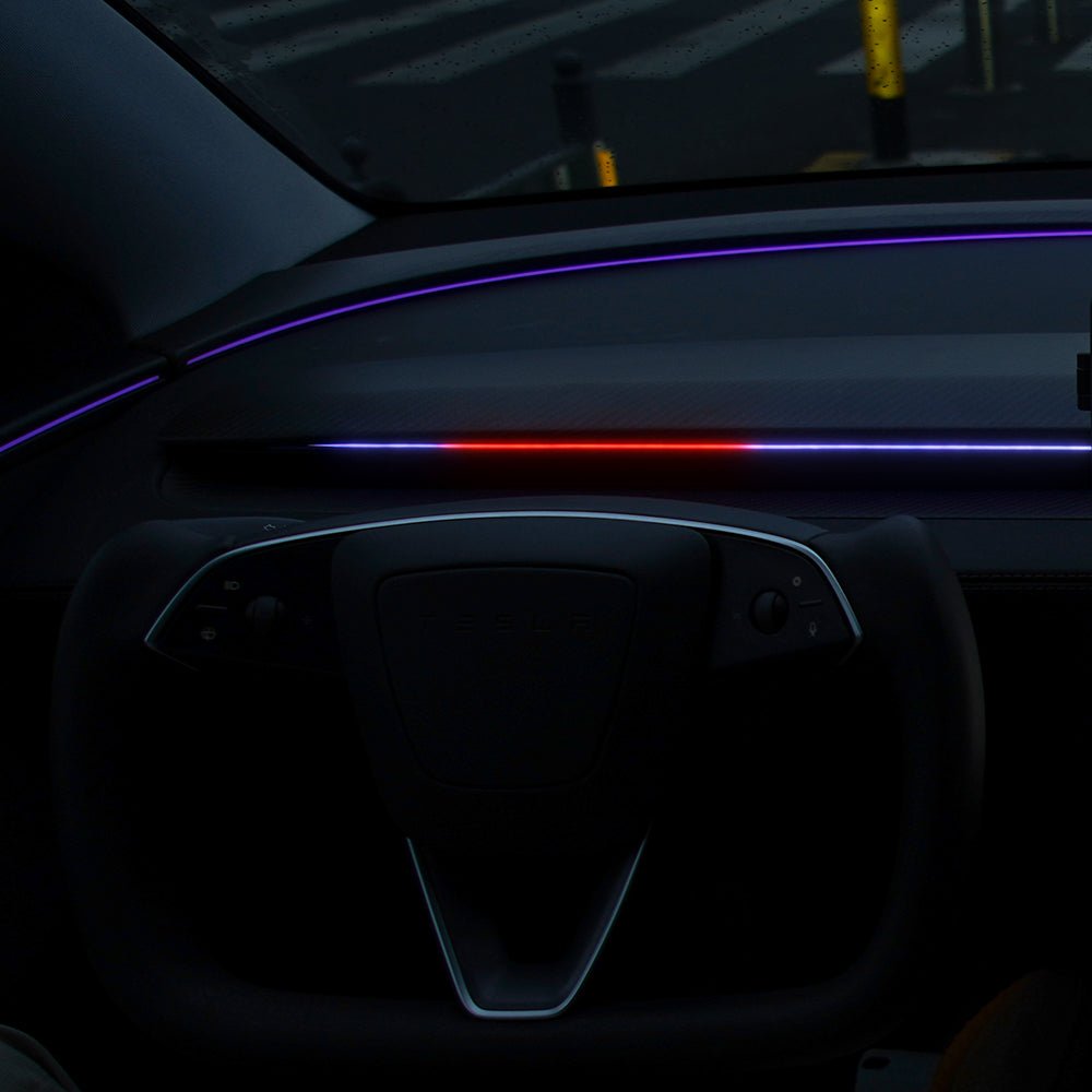 Tesla Model 3/Y NeuroLight ambient dashboard RGB lights with integrated BSD system, illuminated interior lighting in a modern car interior