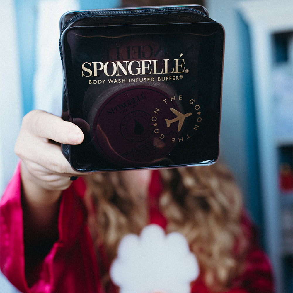 Black Spongellé travel case with zipper closure, compact and stylish for organizing toiletries on the go.