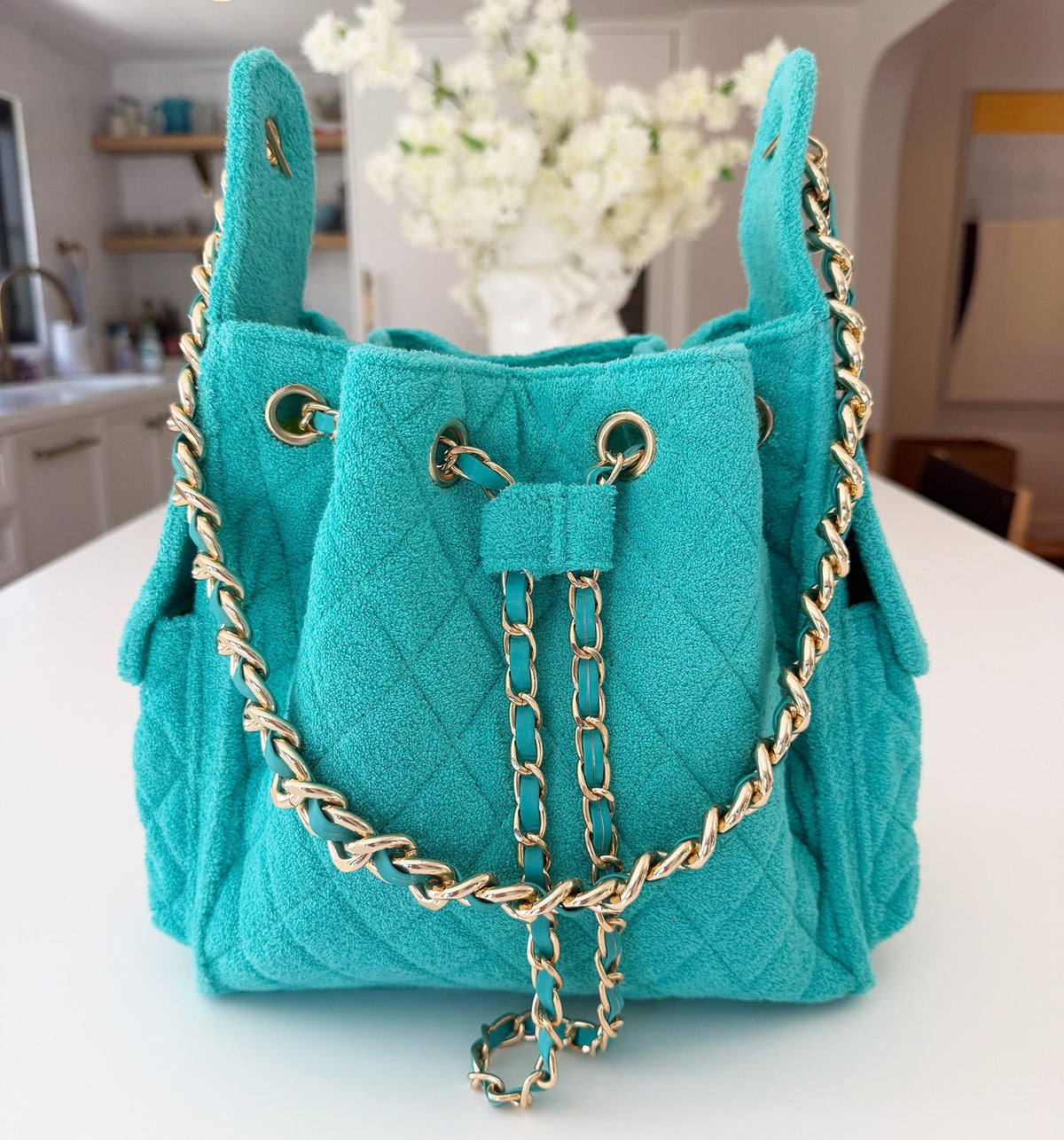 Small turquoise Bayshore Bucket by BEACH HAUS, showing a vibrant, durable plastic bucket perfect for beach and outdoor use.