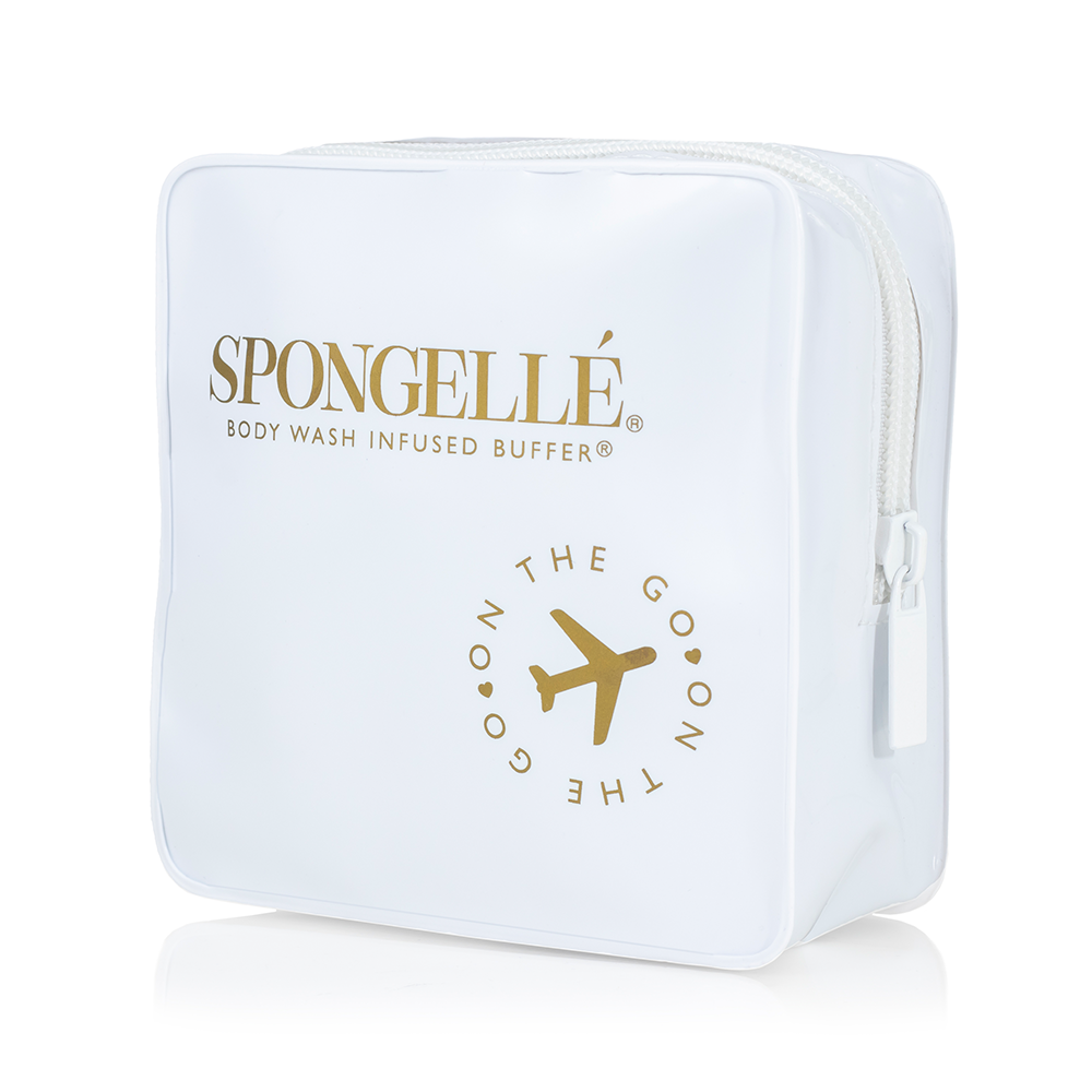 White Spongellé travel case with sturdy zipper and compact design for convenient storage of toiletries on the go.