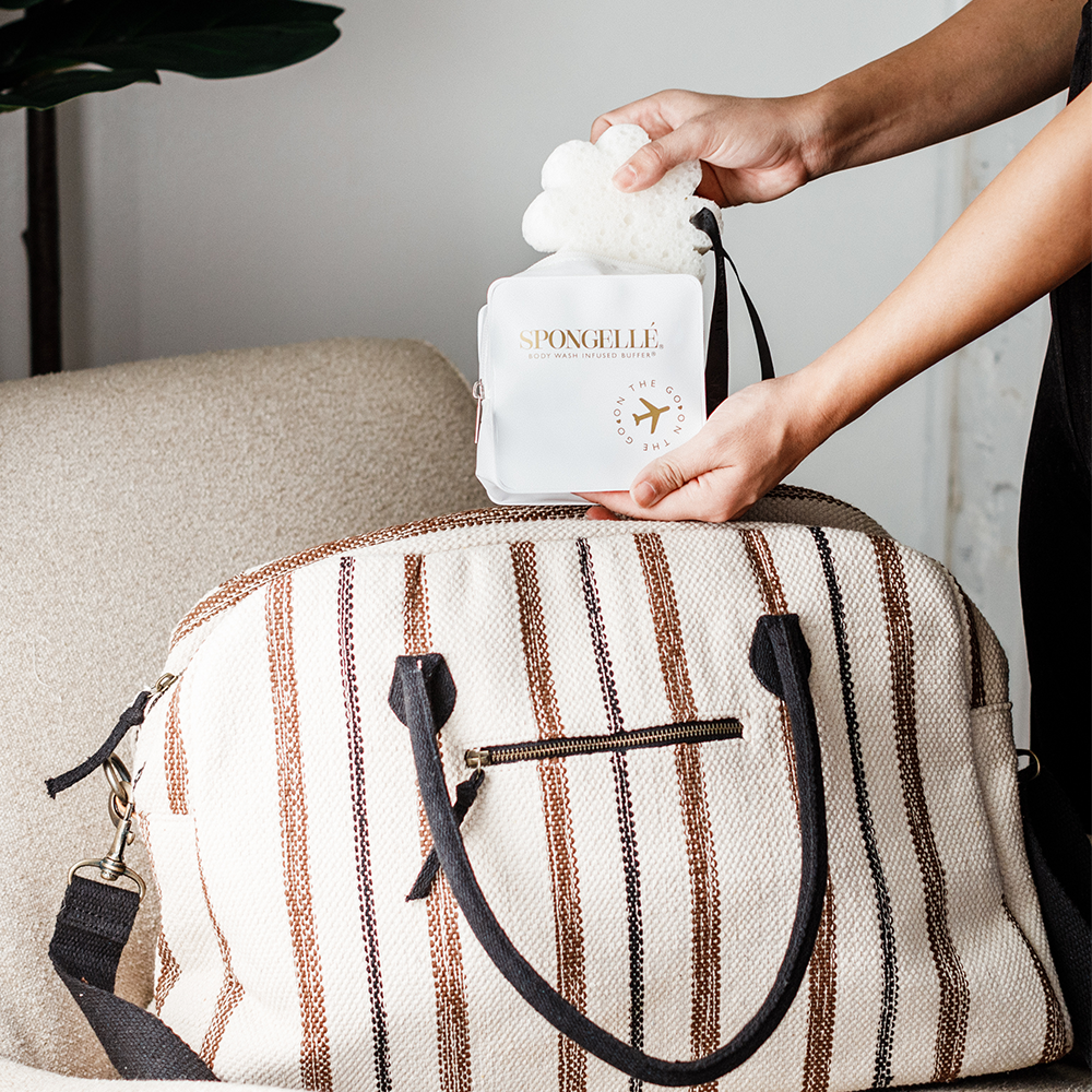 White Spongellé travel case with sleek design, ideal for storing personal items on the go.