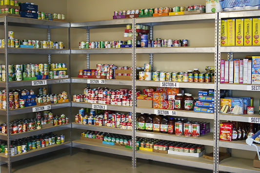 A large metal shelf filled with lots of food