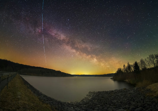 Milky way galaxy and shooting star over the lake