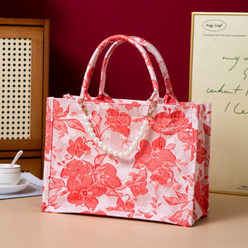 Relief-printed souvenir canvas gift bag with textured design and sturdy fabric handles