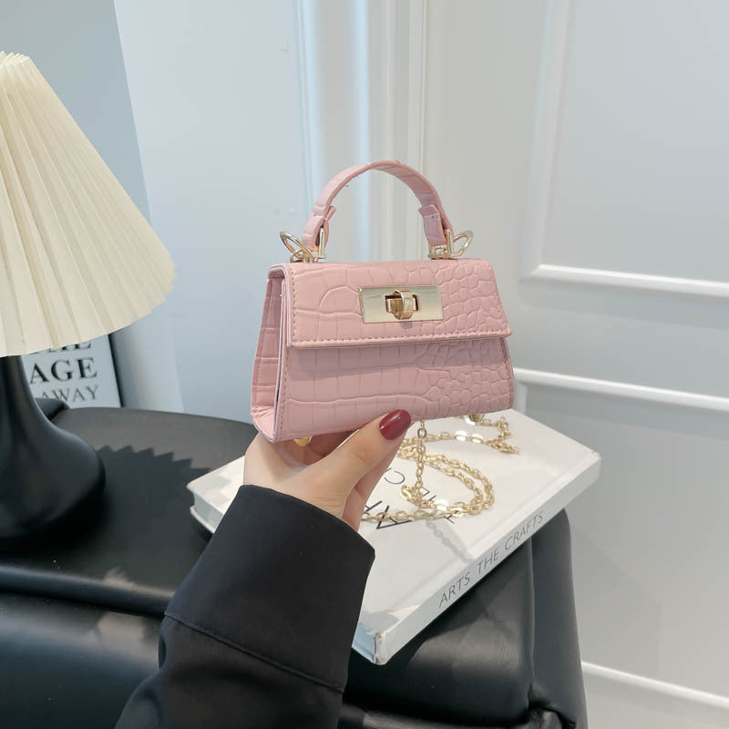 Casual small square handbag with shoulder strap in a compact crossbody design