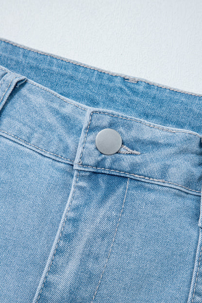 Light blue Lacey Relaxed Patch Jeans by Threaded Pear featuring distressed patches and relaxed fit for casual style.
