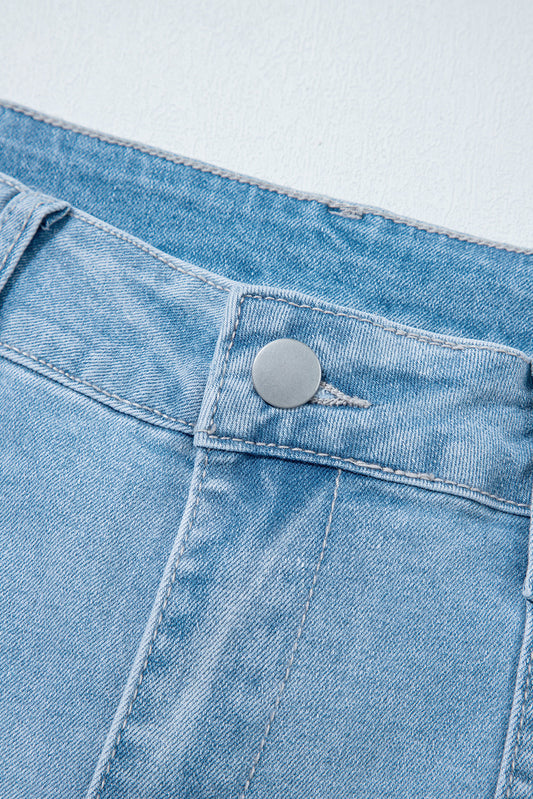 Light blue Lacey Relaxed Patch Jeans by Threaded Pear featuring distressed patches and relaxed fit for casual style.