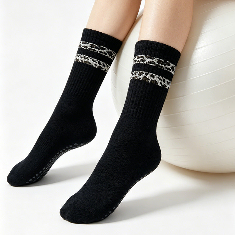 Striped leopard-print floor socks for women, featuring a cozy ankle-high design in brown and black tones