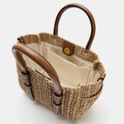 Straw woven hand-held shoulder crossbody bag with textured design and adjustable strap