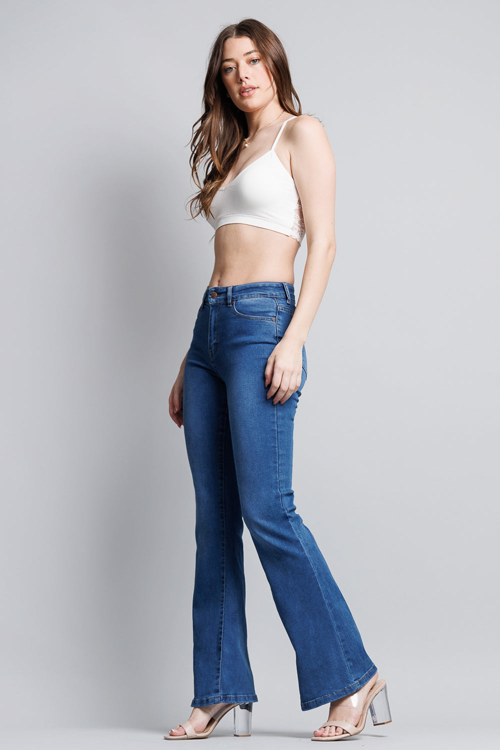 Medium wash Shop ENJEAN super high rise 5-pocket flare jeans with a fitted waist and flared leg silhouette.