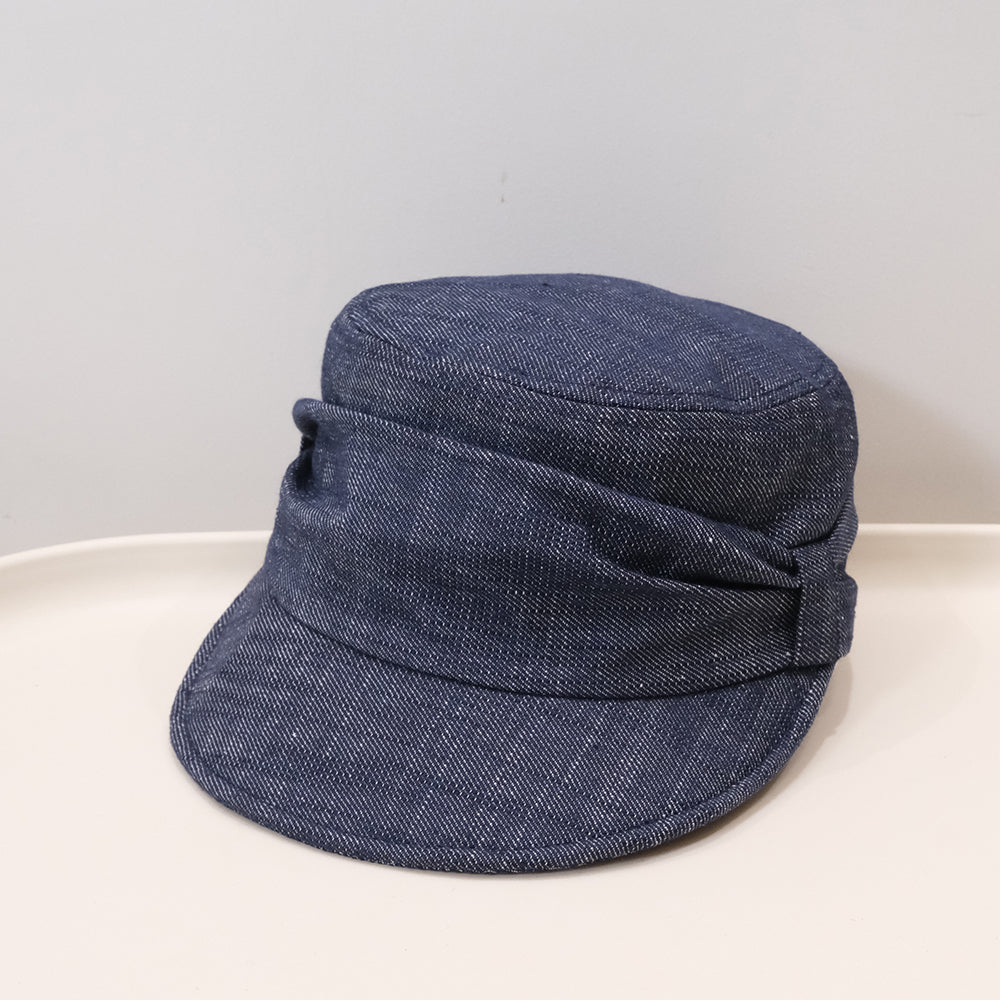 Old money style retro ruffled flat-top bowler hat in a casual artistic design for painters