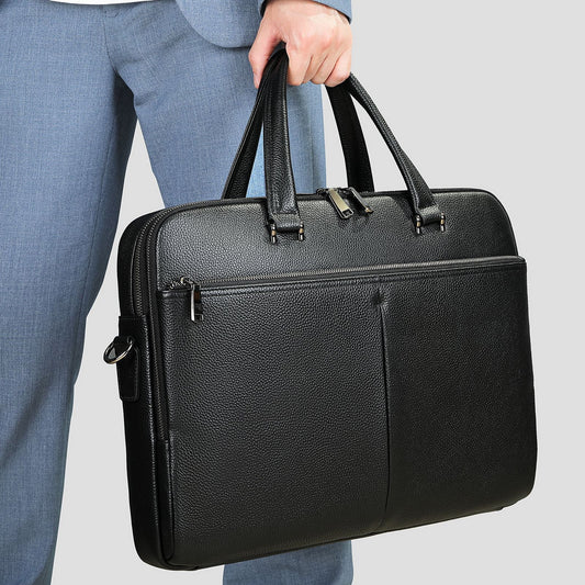 Men's horizontal cowhide briefcase with large capacity for 17-inch computer, featuring a structured handbag design