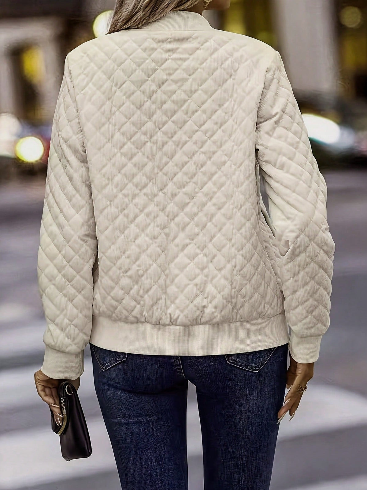 Women's woven quilted bomber jacket with zip-up front, stand collar, and lightweight design