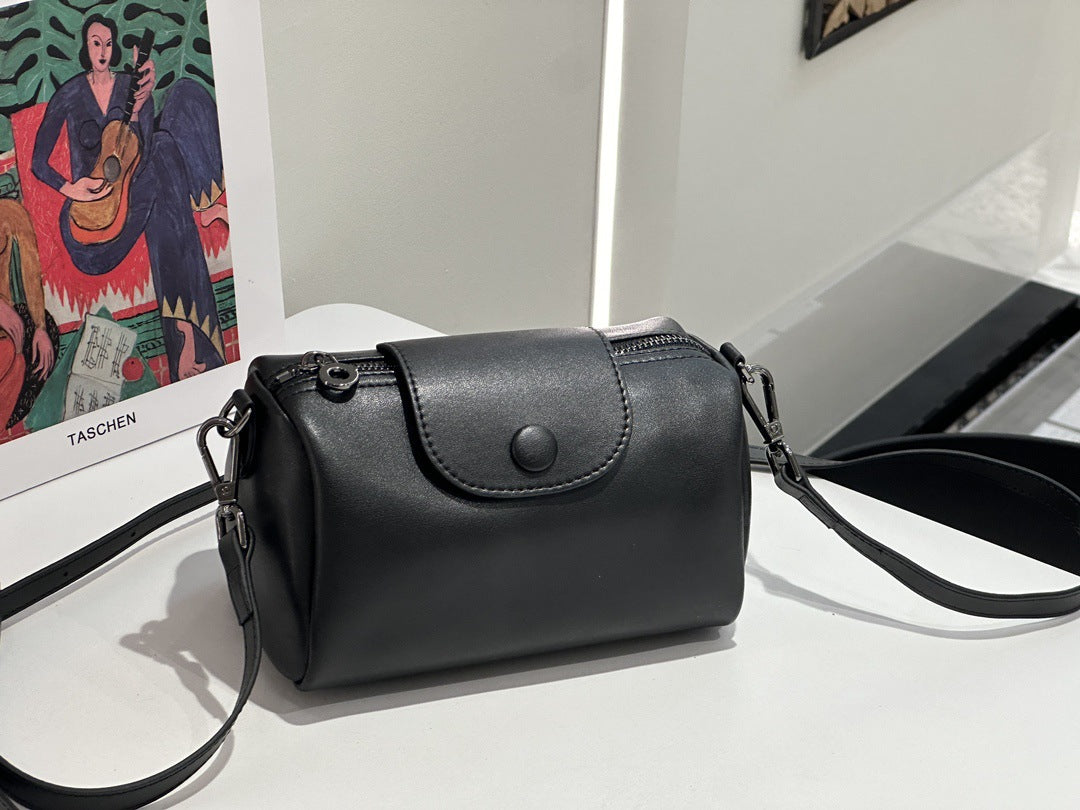 Minimalist leather work desk organizer shoulder and crossbody bag in a versatile pillow bag design