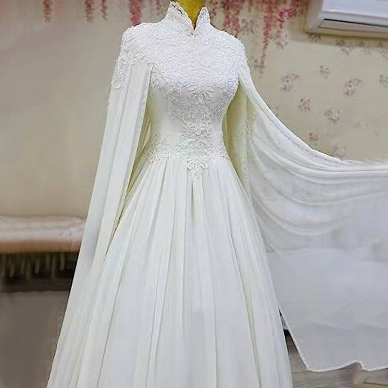 Lace slim long sleeve fishtail wedding dress with elegant fitted silhouette and floor-length train