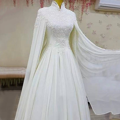 Lace slim long sleeve fishtail wedding dress with elegant fitted silhouette and floor-length train