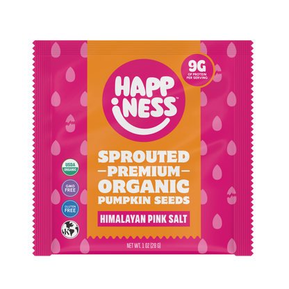 Happiness Minis sprouted organic pumpkin seeds in Himalayan pink salt flavor, in pink packaging with white and orange accents.