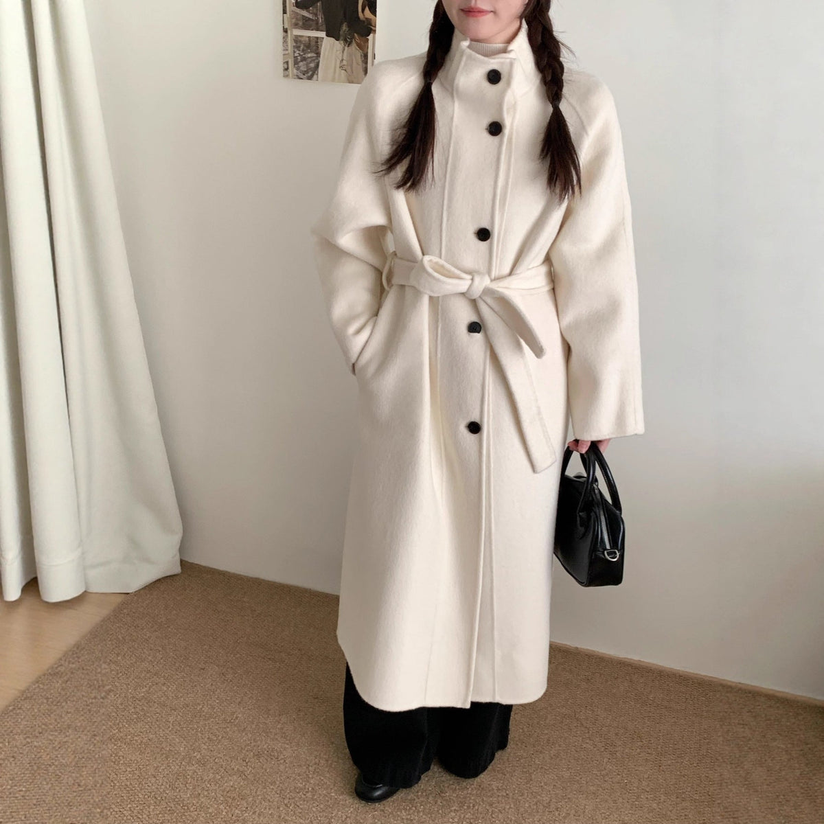 Women’s long wool coat with single-breasted design in a classic silhouette