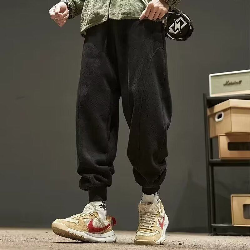 Solid color leg-binding sports casual pants with elastic cuffs, full-length design, and side pockets