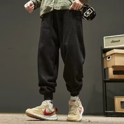 Solid color leg-binding sports casual pants with elastic cuffs, full-length design, and side pockets