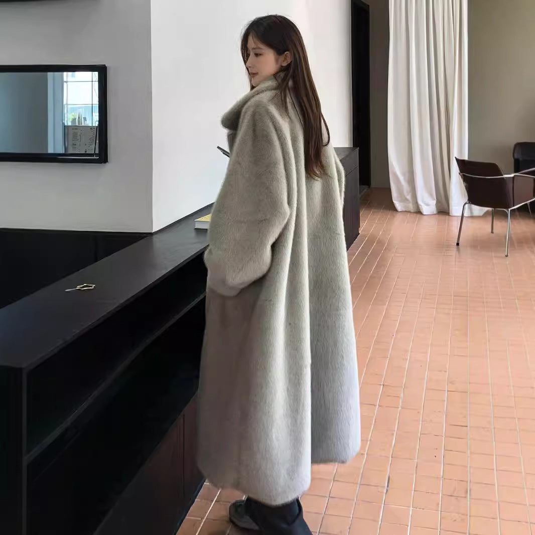 Women's winter extended leather fur coat in a fashionable long silhouette